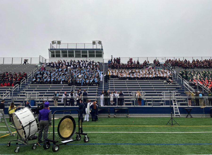Marching Bands from 
all around Harford 
County gather in the 
stands of Bobcat 
Stadium at Bel Air 
High School on 
October 26th as they 
wait for the rest of the bands to show up so they can begin 
performing.