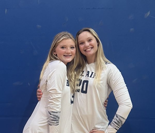 Writer Emma Duvall poses with teammate Brooke Hopkins, who was interviewed for this article.