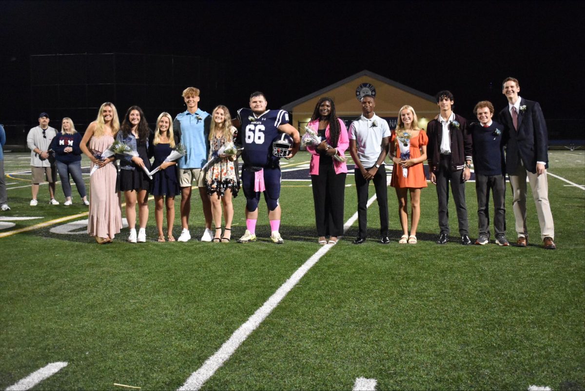 The 2023 Homecoming Court at the Friday night football game.