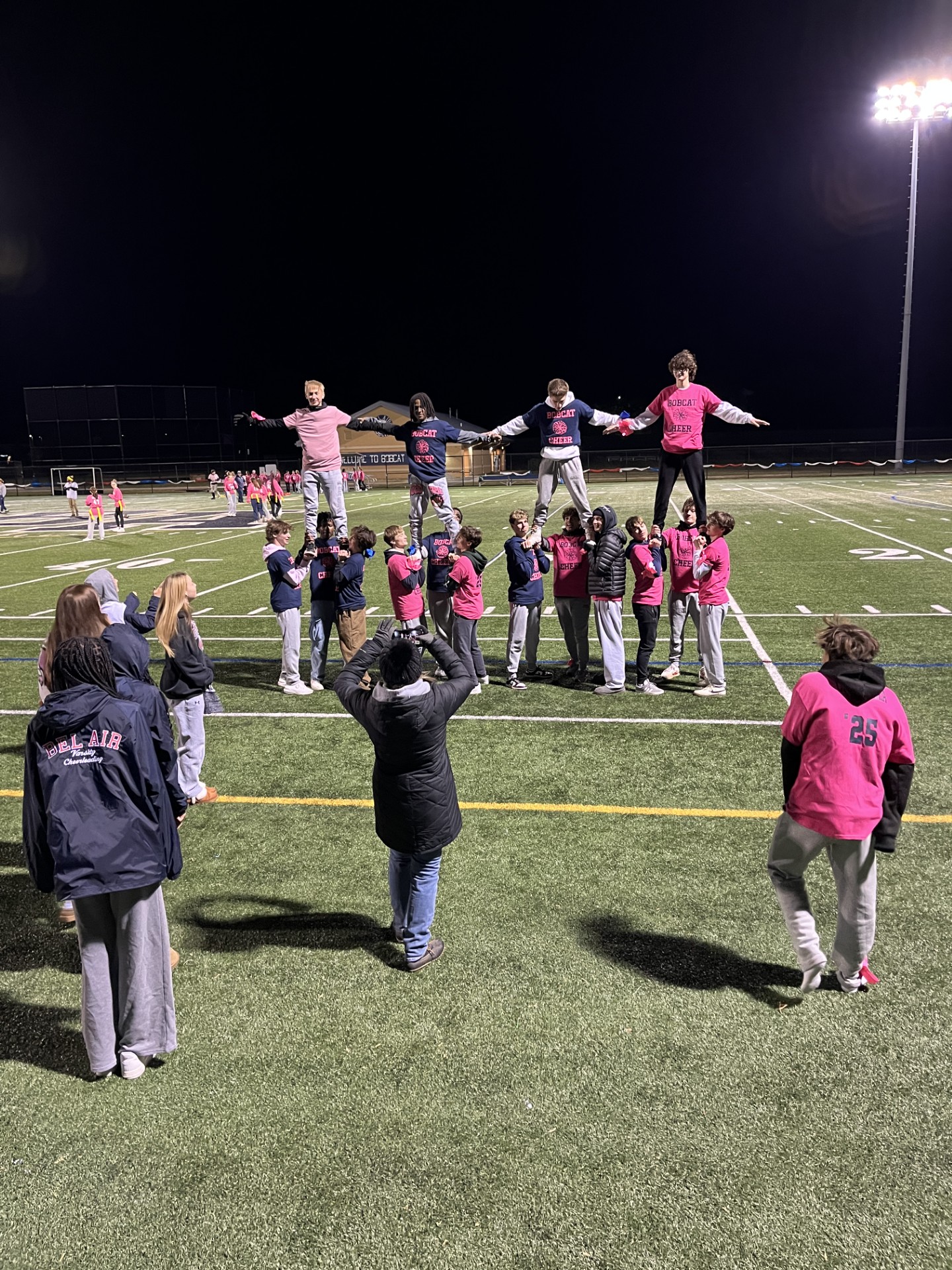 Cheerleaders pyramid during their halftime performance.