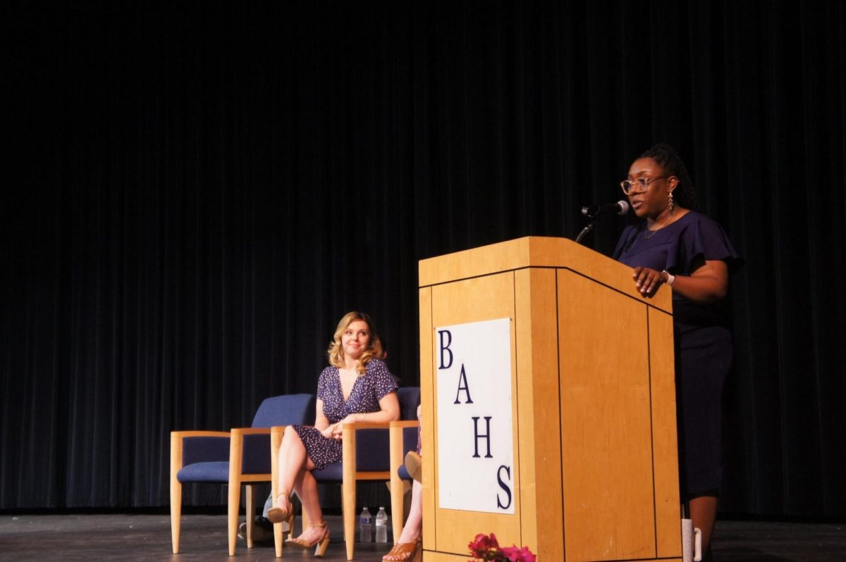 Ms. Hamilton delivering speech during Biomedical Capstone for graduating seniors